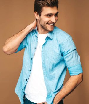 portrait-handsome-smiling-stylish-young-man-model-dressed-blue-shirt-clothes-fashion-man-posing (1)